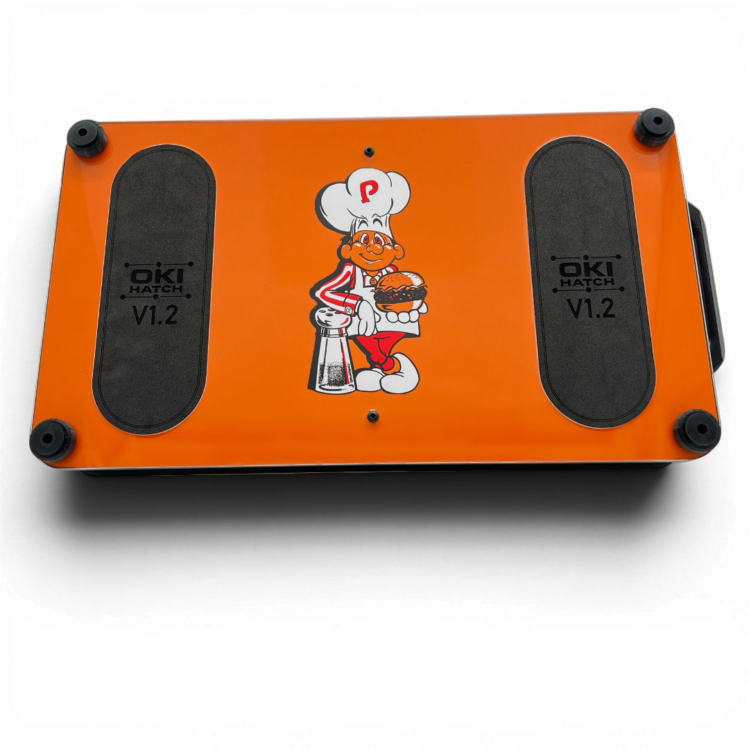 Bottom of BurgerTime-themed OKI Hatch with foam pads and rubber feet.