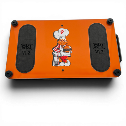 Bottom of BurgerTime-themed OKI Hatch with foam pads and rubber feet.