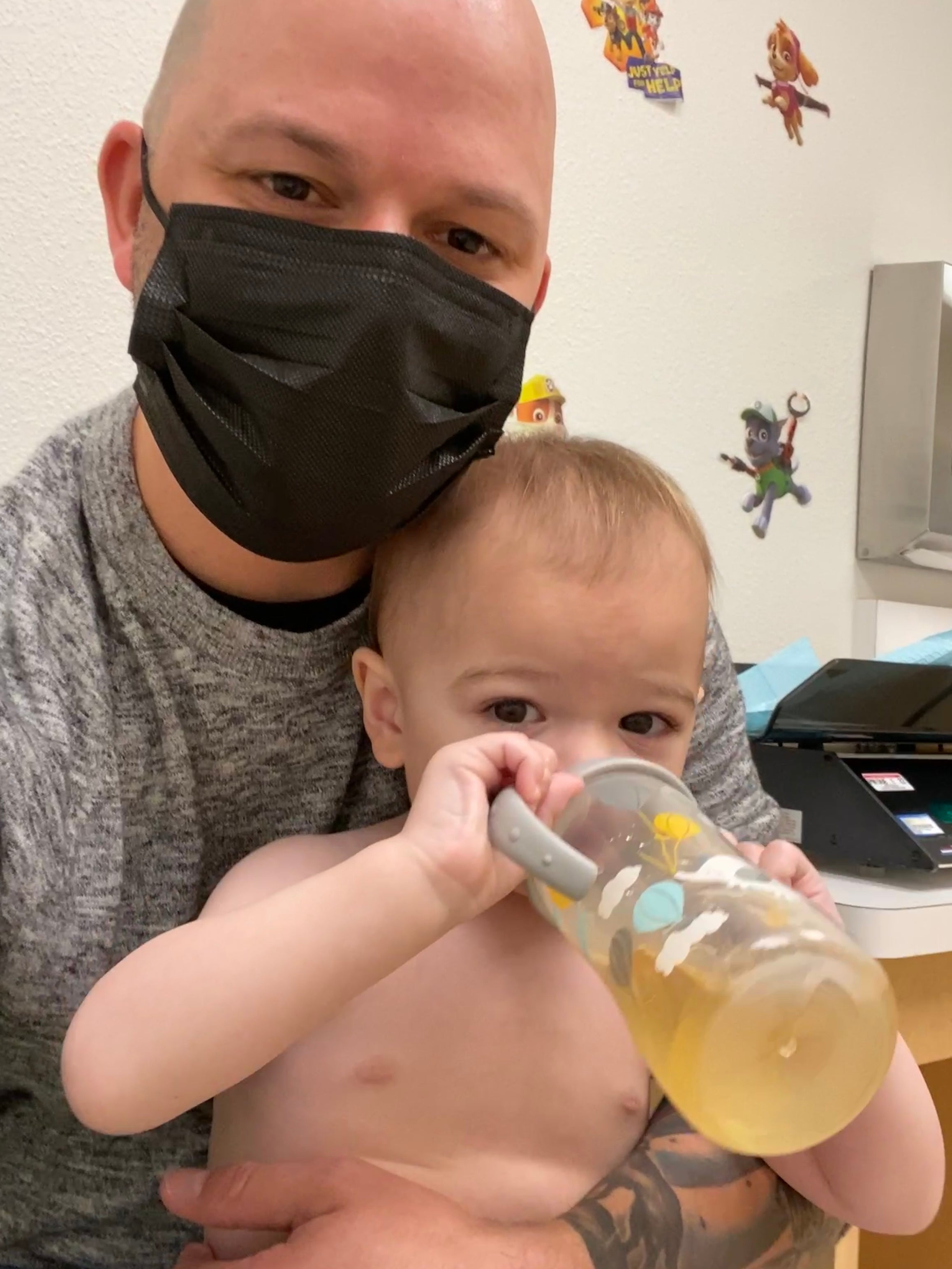Scott holding Jack at the doctor on March 24, 2021