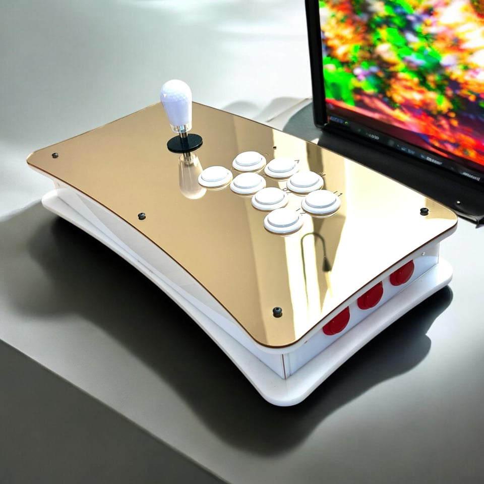 Scott’s first acrylic FightStick beside a laptop